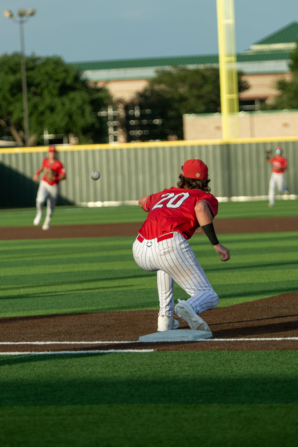 Sutton Hull makes an out at first base during Saturday's Regional Quarterfinal between Katy and Tompkins at Cy-Springs.